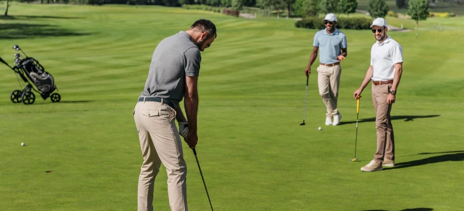 players on golf course green